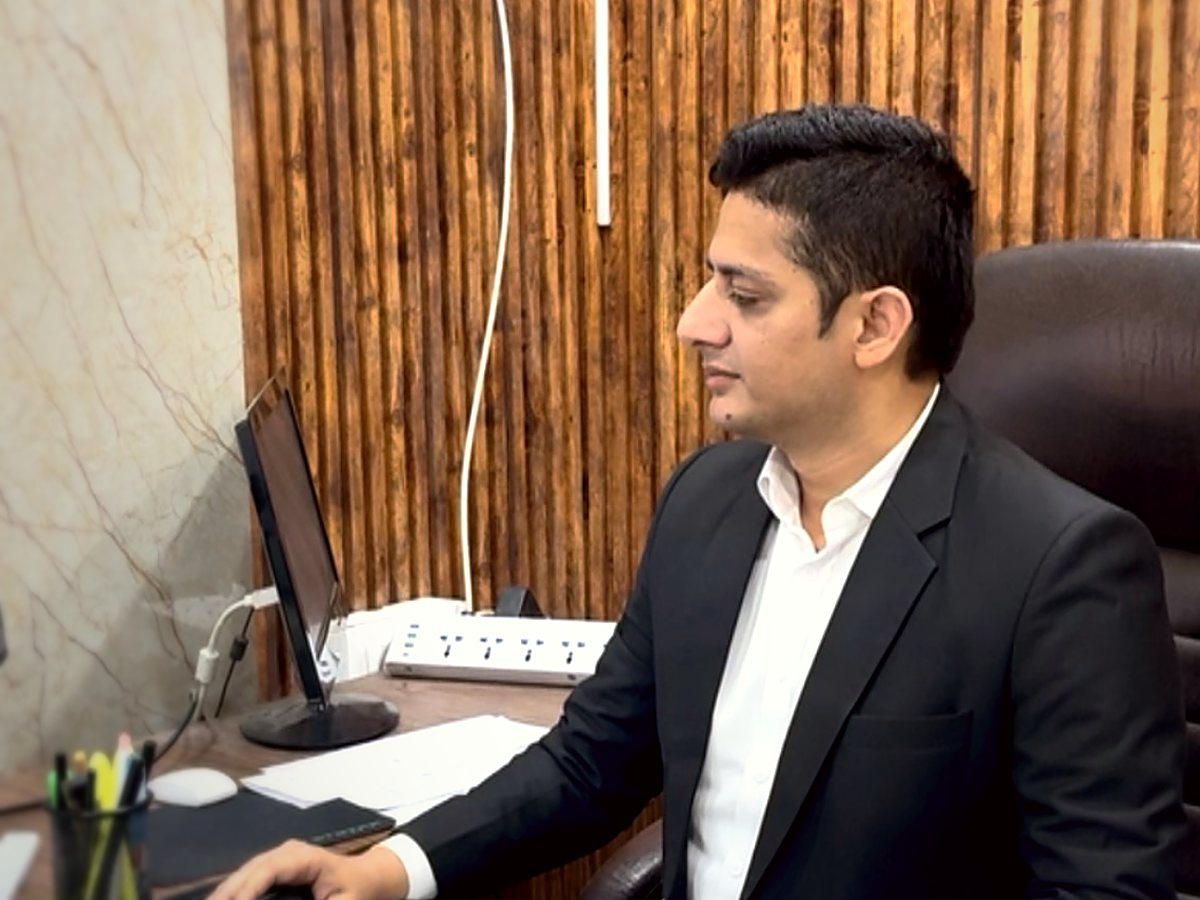 Advocate Narinder Kumar working at the office